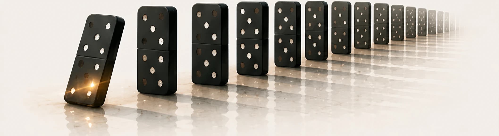 A sequence of falling dominoes.