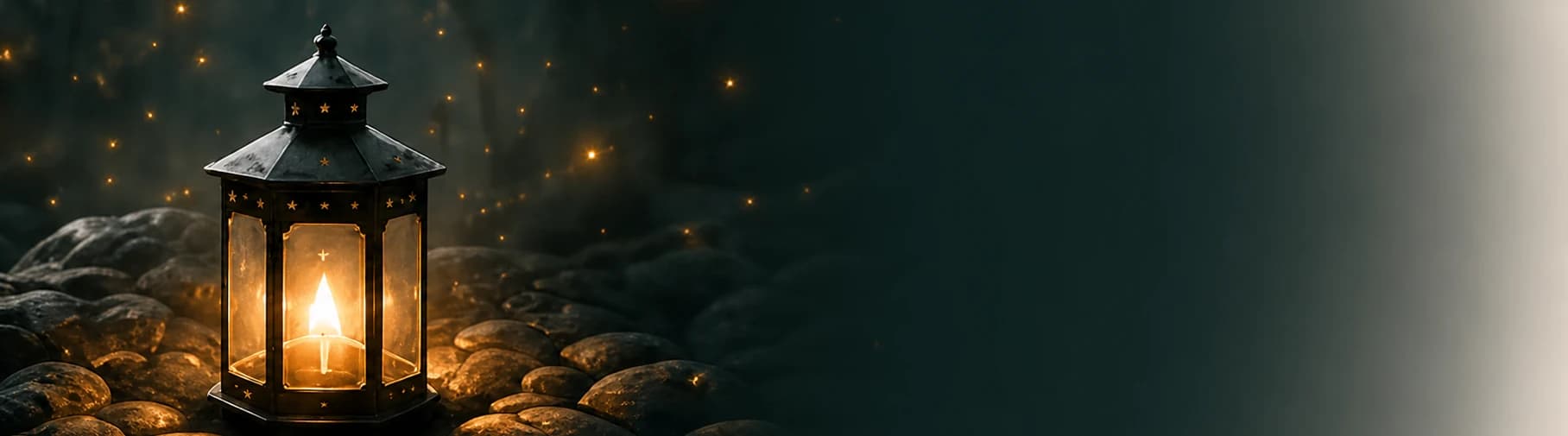 A glowing lantern lighting a dark stone path.